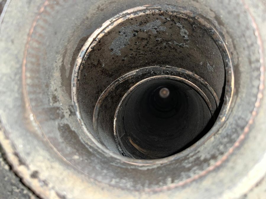 View straight down a stainless steel chimney flue liner